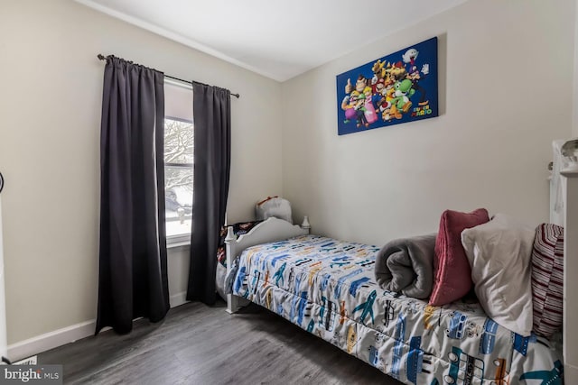 bedroom with wood-type flooring