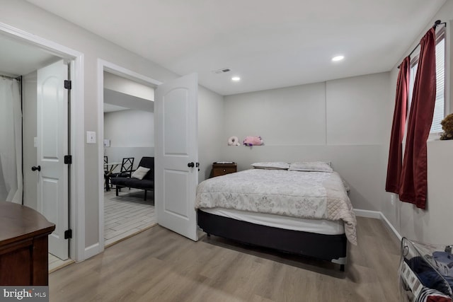 bedroom with light wood-type flooring