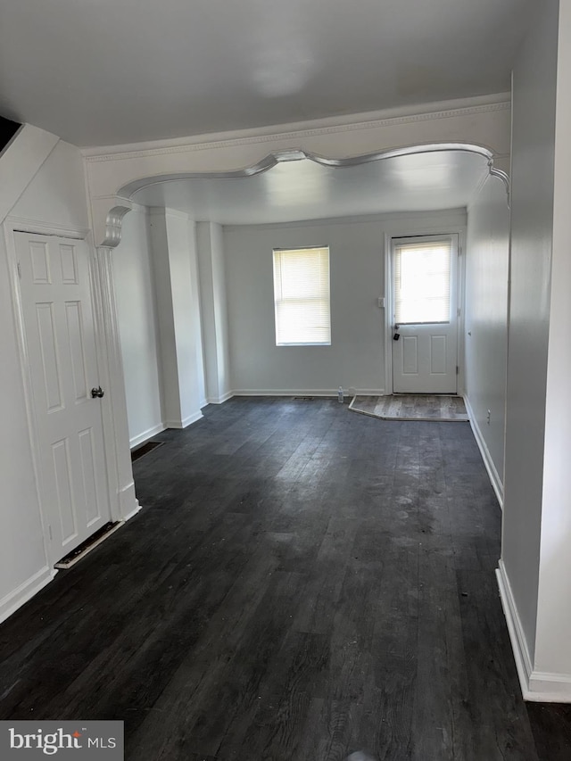 empty room with dark wood-type flooring