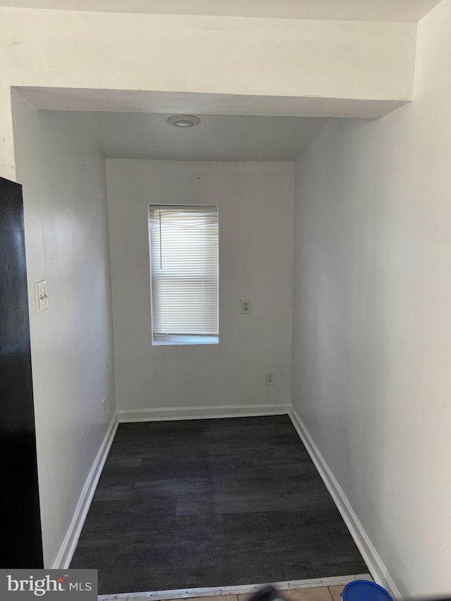 empty room featuring dark hardwood / wood-style floors