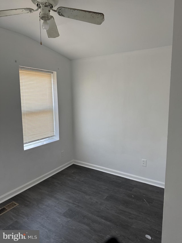 spare room featuring dark hardwood / wood-style flooring and ceiling fan