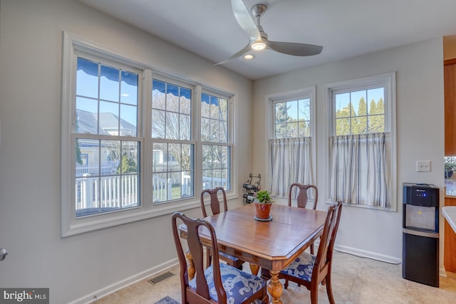 dining area featuring light tile patterned floors and ceiling fan