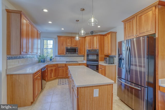 kitchen featuring a kitchen island, appliances with stainless steel finishes, hanging light fixtures, and backsplash