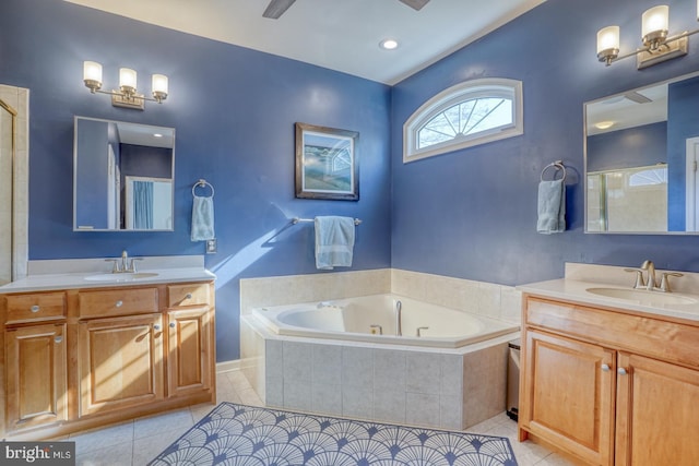 bathroom with vanity, tile patterned floors, and plus walk in shower