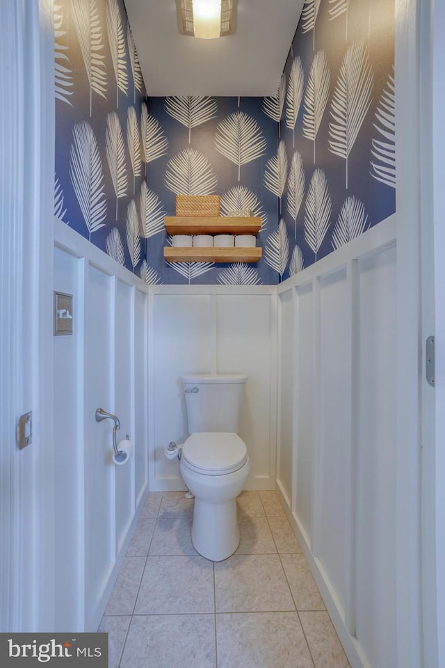 bathroom with tile patterned flooring and toilet