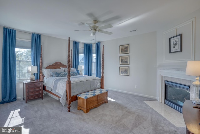 bedroom featuring light colored carpet and ceiling fan