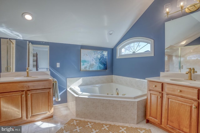 bathroom featuring lofted ceiling, vanity, tile patterned floors, and separate shower and tub