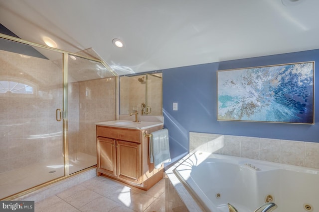 bathroom with vanity, plus walk in shower, and tile patterned flooring