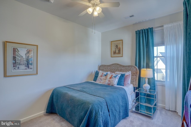 bedroom with light colored carpet and ceiling fan