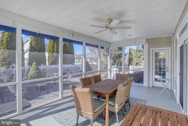 sunroom / solarium with ceiling fan