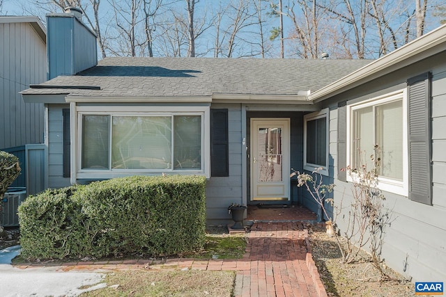 doorway to property with central AC