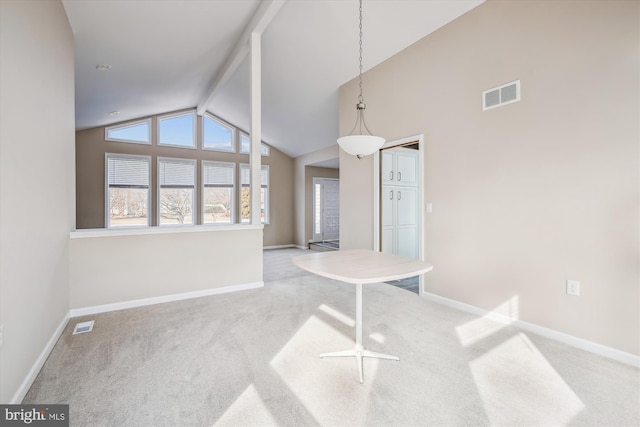 interior space with beam ceiling and high vaulted ceiling