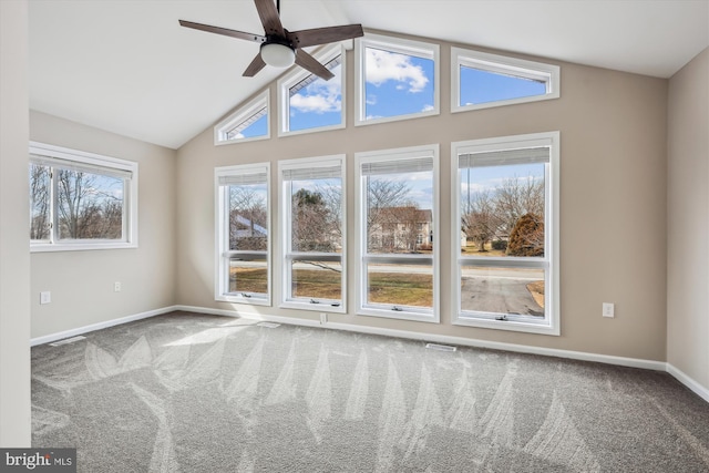 unfurnished room featuring lofted ceiling, carpet flooring, and ceiling fan