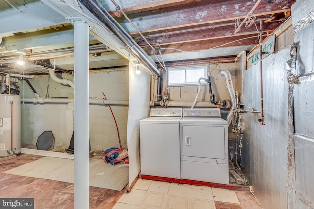 basement with separate washer and dryer and water heater