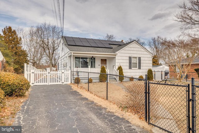 view of front of home featuring solar panels