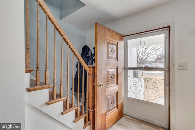 entrance foyer with light hardwood / wood-style flooring