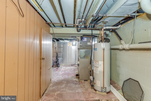 utility room with heating unit and gas water heater