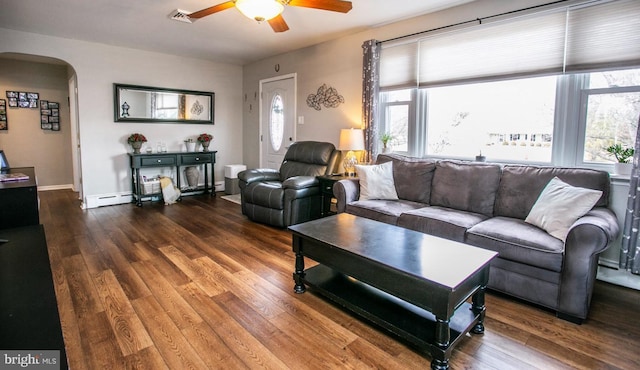 living room featuring a baseboard heating unit, hardwood / wood-style floors, and ceiling fan