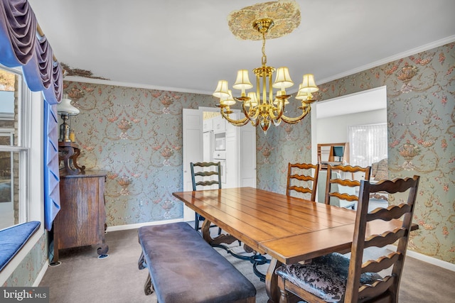 dining area featuring crown molding, an inviting chandelier, and dark carpet