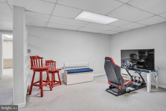 interior space with carpet floors and a drop ceiling