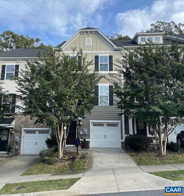 multi unit property featuring central AC and a garage