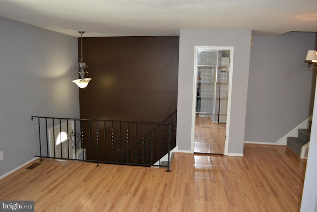 entryway with hardwood / wood-style flooring