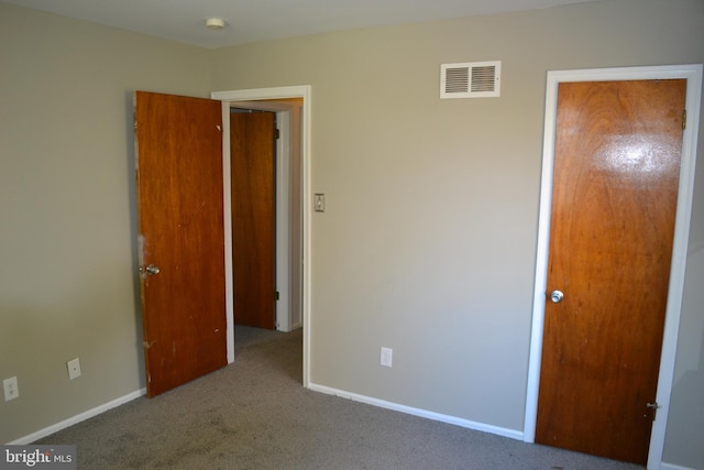 unfurnished bedroom featuring carpet