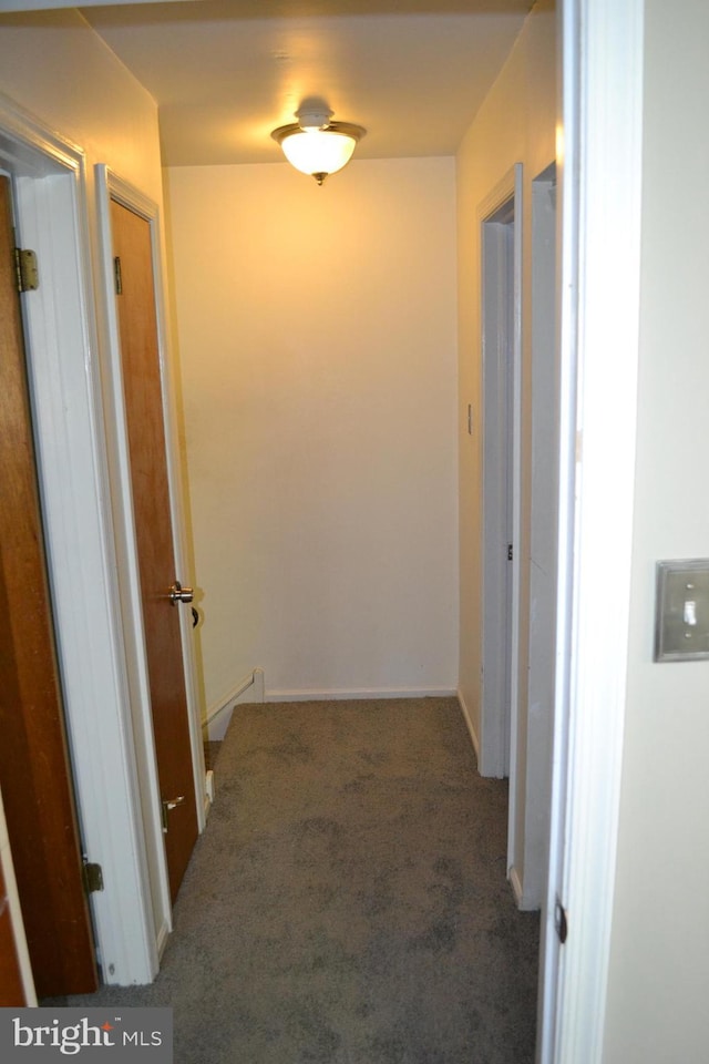 hallway with dark carpet