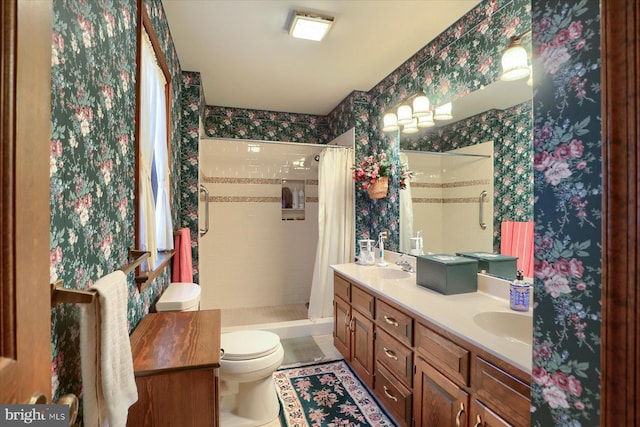 bathroom with vanity, a shower with curtain, and toilet