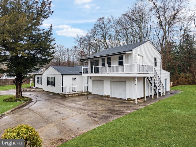 view of front of home with a garage and a front yard