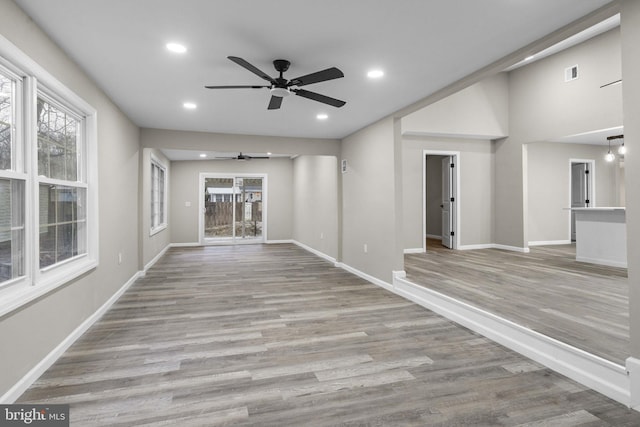 unfurnished room featuring ceiling fan and light hardwood / wood-style flooring