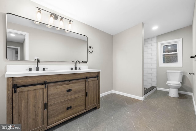 bathroom featuring vanity, a shower, and toilet