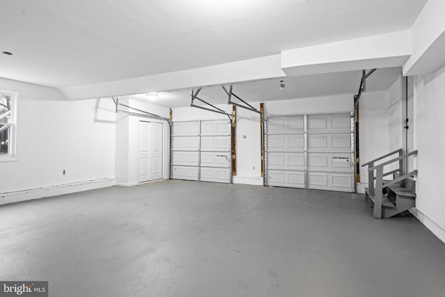 garage featuring a baseboard heating unit