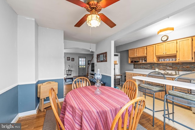 dining area featuring light hardwood / wood-style flooring and ceiling fan