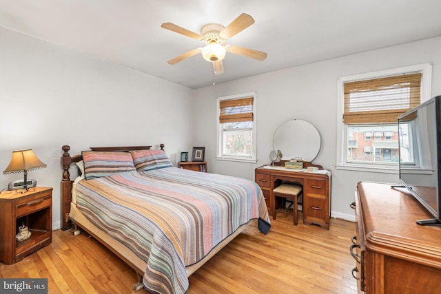 bedroom featuring ceiling fan and light hardwood / wood-style floors