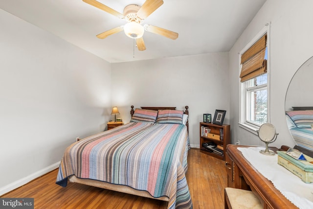 bedroom featuring ceiling fan and wood-type flooring