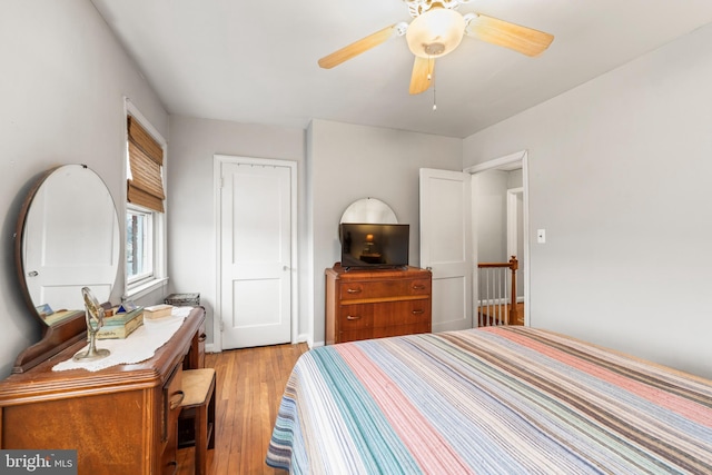 bedroom with ceiling fan and light hardwood / wood-style floors