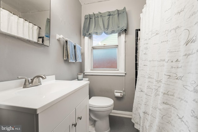 bathroom featuring vanity and toilet