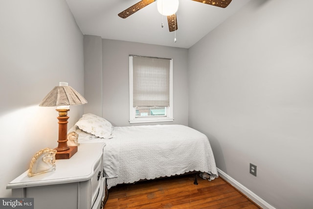 bedroom with dark wood-type flooring and ceiling fan