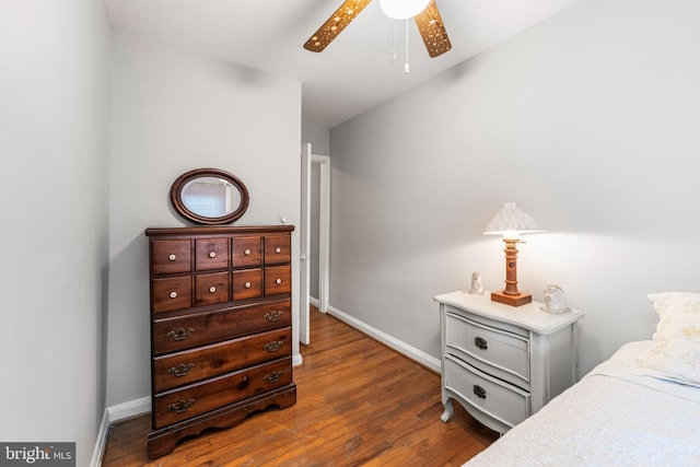 bedroom featuring dark wood-type flooring and ceiling fan