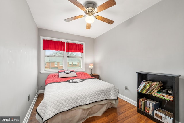 bedroom with ceiling fan and wood-type flooring