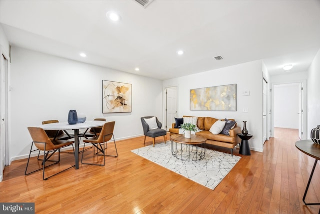 living room with light hardwood / wood-style flooring