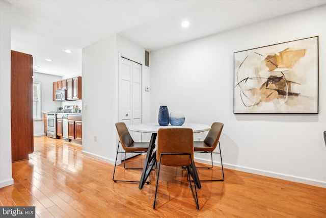 dining room featuring light hardwood / wood-style flooring