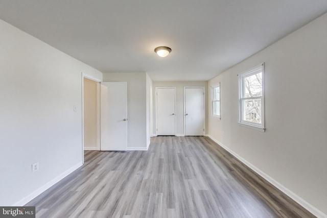 unfurnished room featuring light hardwood / wood-style flooring