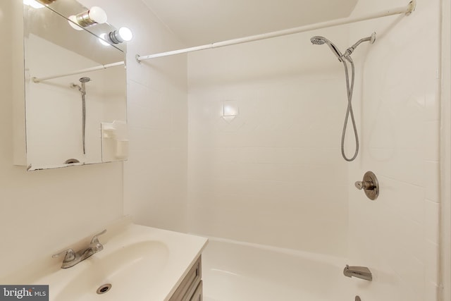 bathroom featuring vanity and tiled shower / bath combo