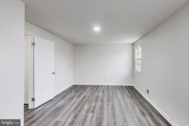 empty room with light hardwood / wood-style floors