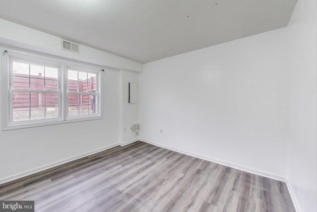 unfurnished room featuring light wood-type flooring