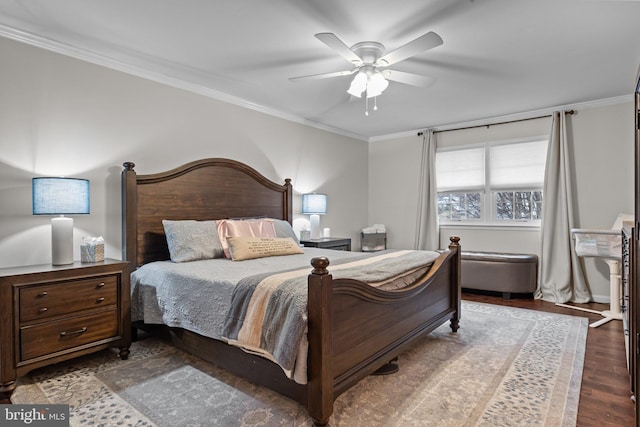 bedroom with wood-type flooring, ornamental molding, and ceiling fan