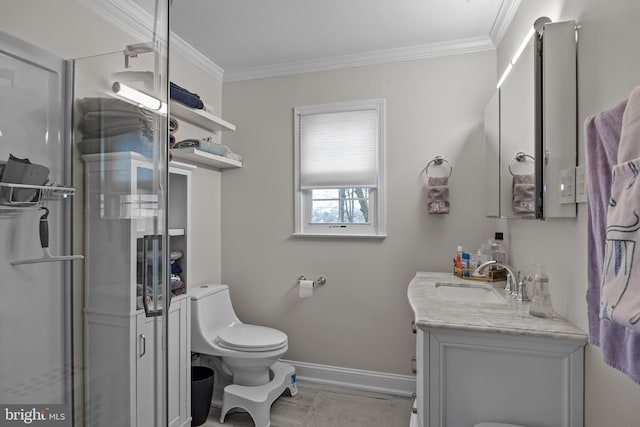 bathroom featuring crown molding, vanity, toilet, and a shower with door