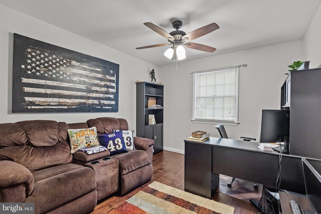 office area with ceiling fan and dark hardwood / wood-style flooring